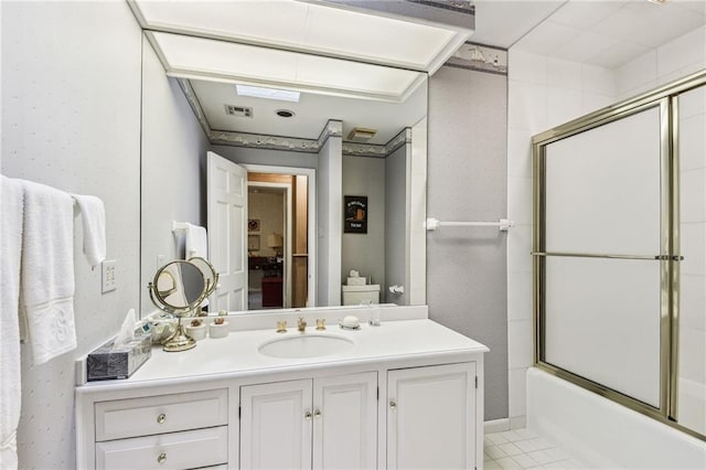 full bathroom featuring tile patterned flooring, toilet, vanity, and combined bath / shower with glass door