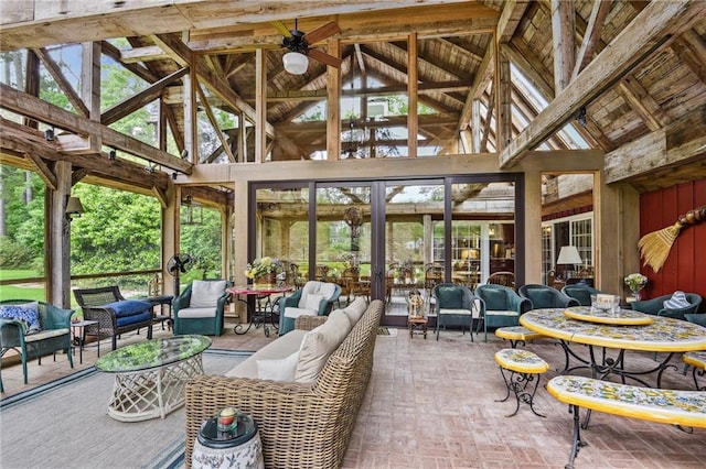 sunroom / solarium featuring ceiling fan and vaulted ceiling