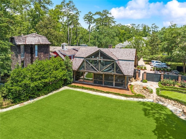 rear view of house with a yard