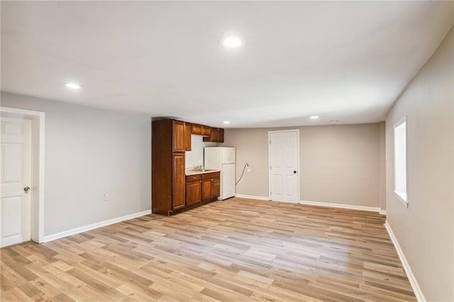 unfurnished living room with light hardwood / wood-style flooring