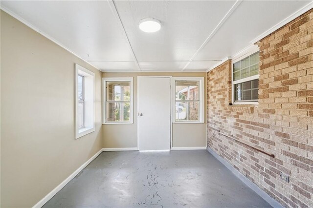 spare room featuring concrete flooring