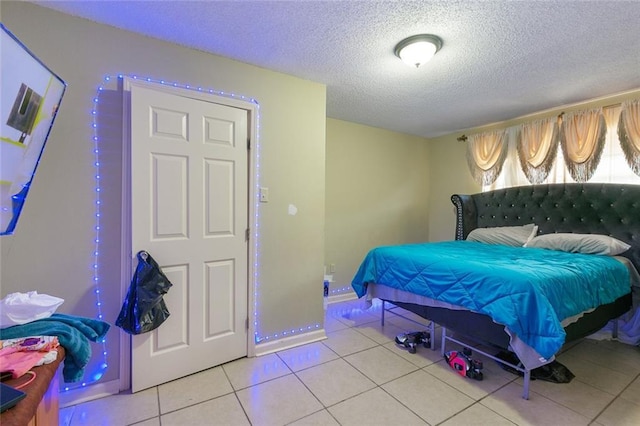 724042 Boston Dr, New Orleans, LA 70127 - tiled bedroom with a textured ceiling