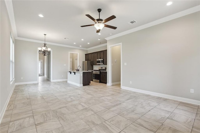 unfurnished living room featuring ornamental molding, sink, and ceiling fan with notable chandelier