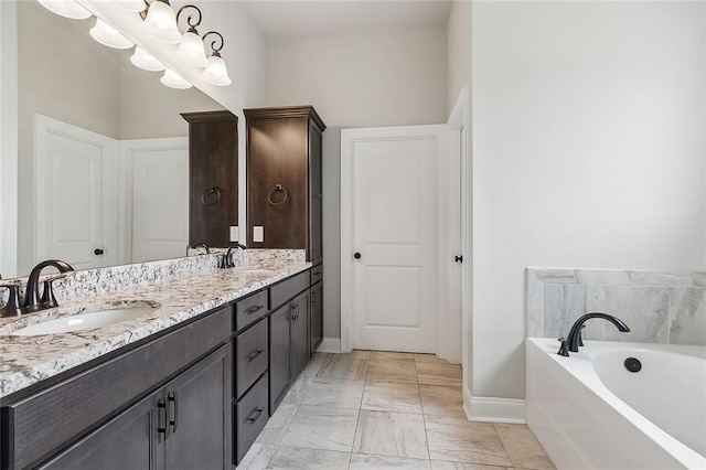 bathroom featuring a tub to relax in and vanity