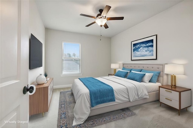 bedroom featuring light carpet and ceiling fan