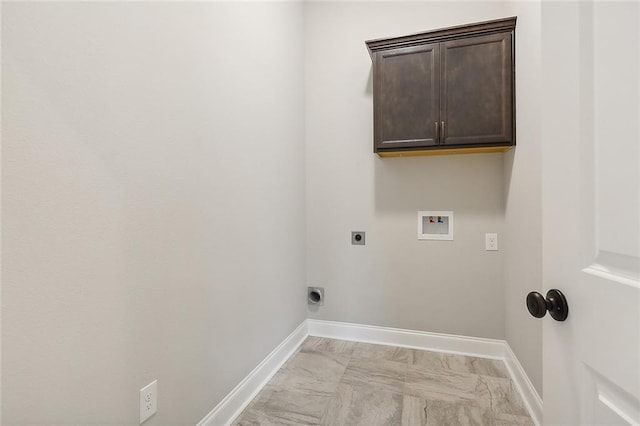 washroom with hookup for a washing machine, electric dryer hookup, and cabinets