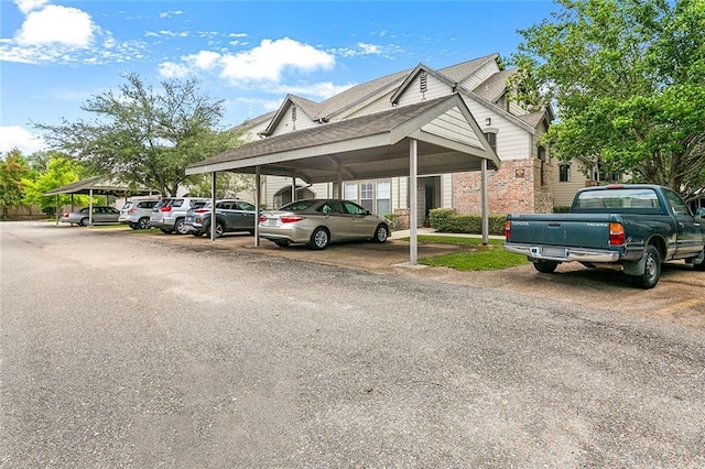 view of parking / parking lot with a carport