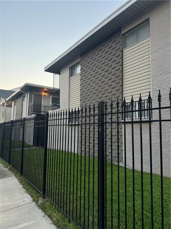 view of side of home featuring a yard