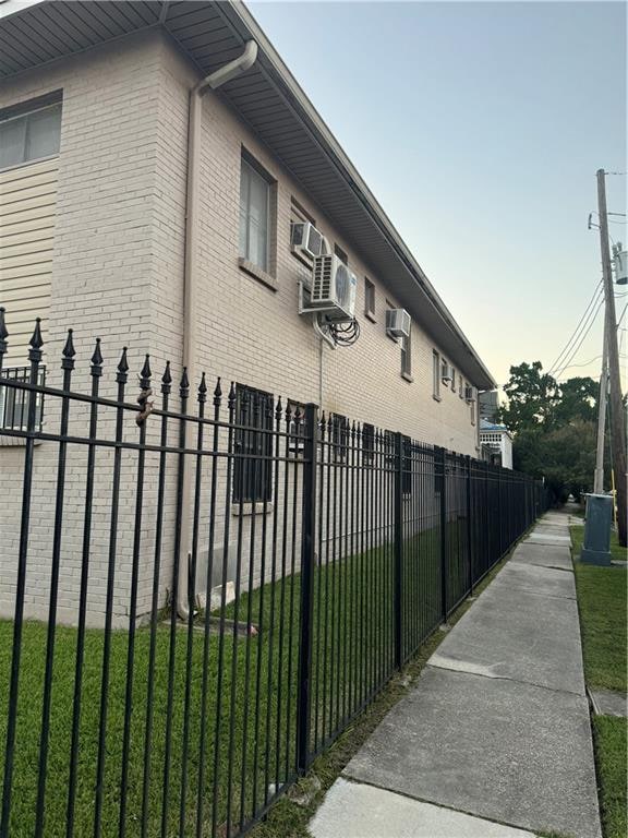 view of side of property with a lawn