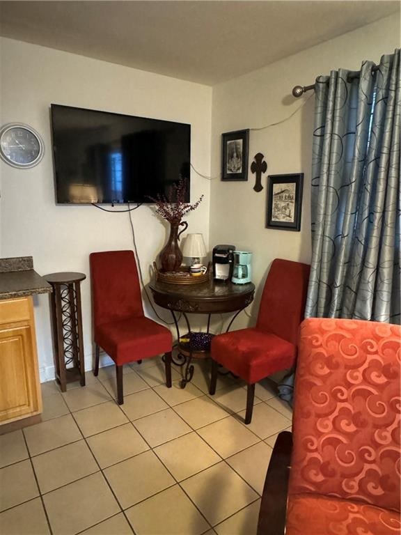 sitting room with light tile patterned floors