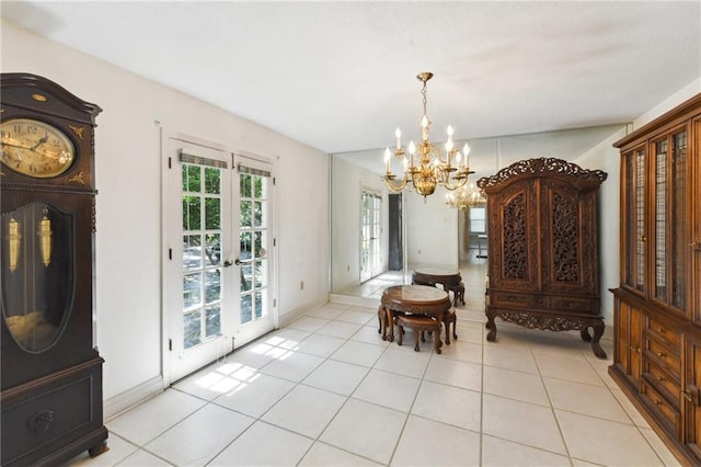 tiled dining space with a chandelier and french doors