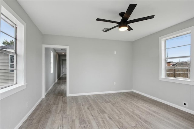 spare room featuring ceiling fan and light hardwood / wood-style flooring