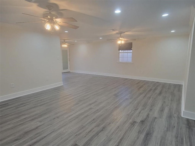 empty room featuring ceiling fan and hardwood / wood-style flooring