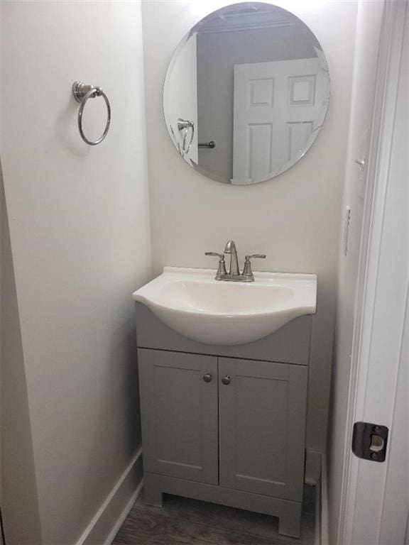 bathroom with vanity and hardwood / wood-style flooring