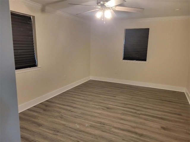 spare room featuring ceiling fan, ornamental molding, and dark hardwood / wood-style flooring