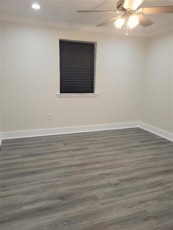 4985 Feliciana Dr, New Orleans, LA 70126 - unfurnished room with crown molding, recessed lighting, dark wood-style floors, baseboards, and a ceiling fan