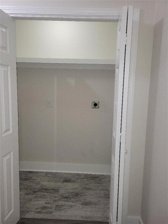 laundry area featuring dark hardwood / wood-style floors and hookup for an electric dryer