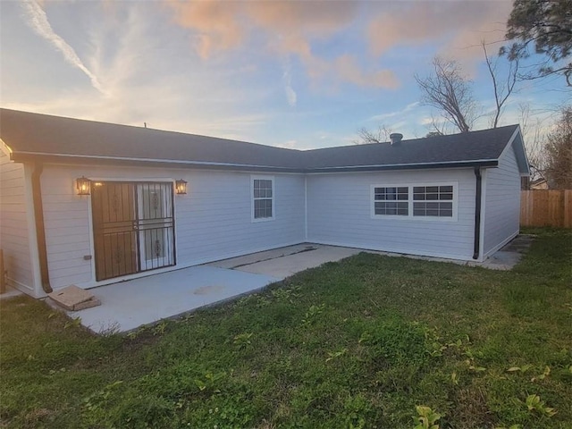 4985 Feliciana Dr, New Orleans, LA 70126 - back of house at dusk featuring a patio