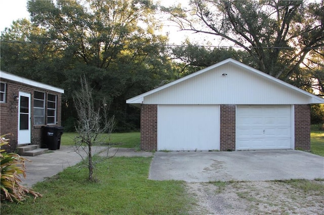 garage featuring a lawn