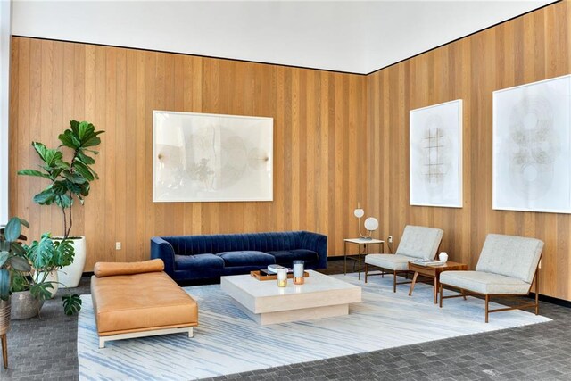 living room with wood walls