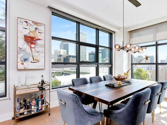 dining room featuring light hardwood / wood-style floors and an inviting chandelier