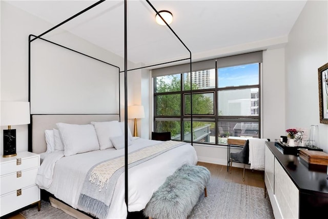 bedroom featuring dark hardwood / wood-style flooring