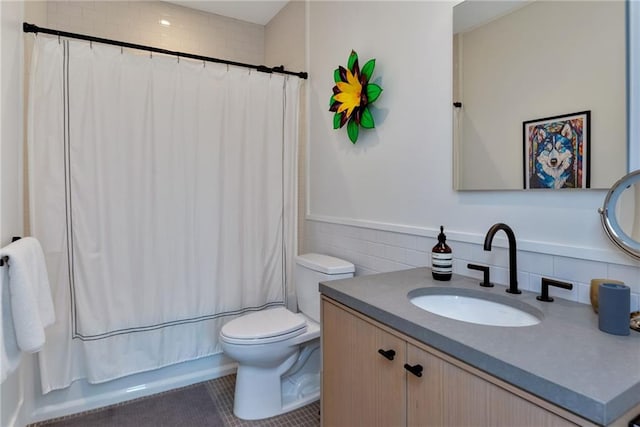 full bathroom with vanity, toilet, tile patterned flooring, and shower / tub combo with curtain