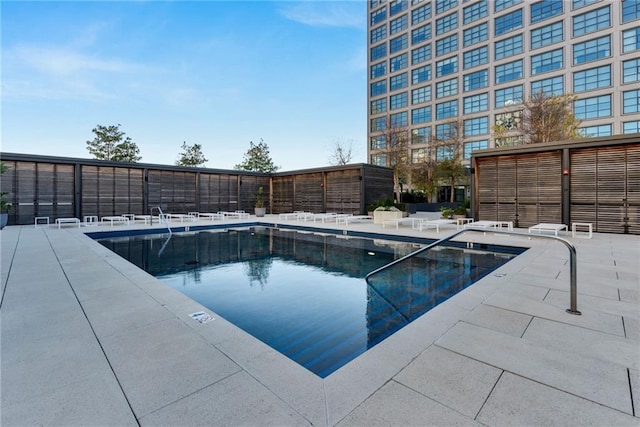 view of swimming pool with a patio