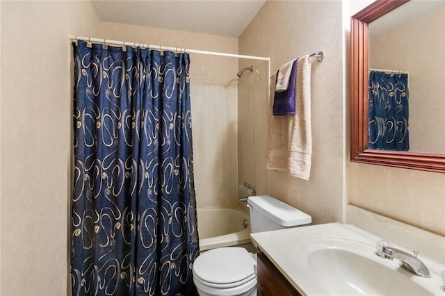 full bathroom featuring vanity, shower / bathtub combination with curtain, toilet, and a textured ceiling