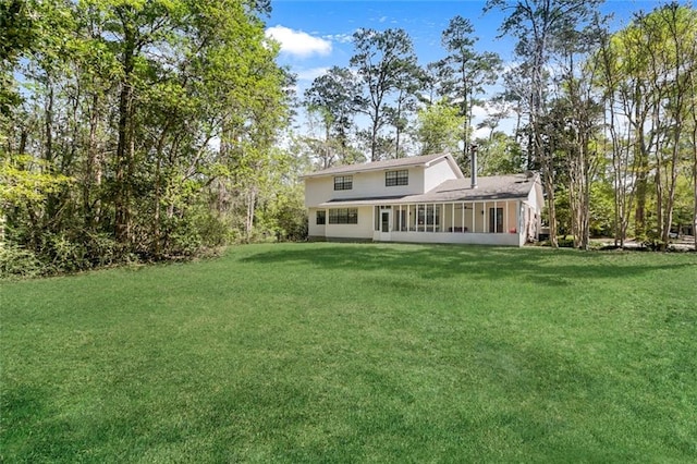 exterior space featuring a sunroom and a front yard