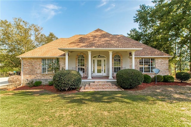 view of front of home featuring a front yard and a porch