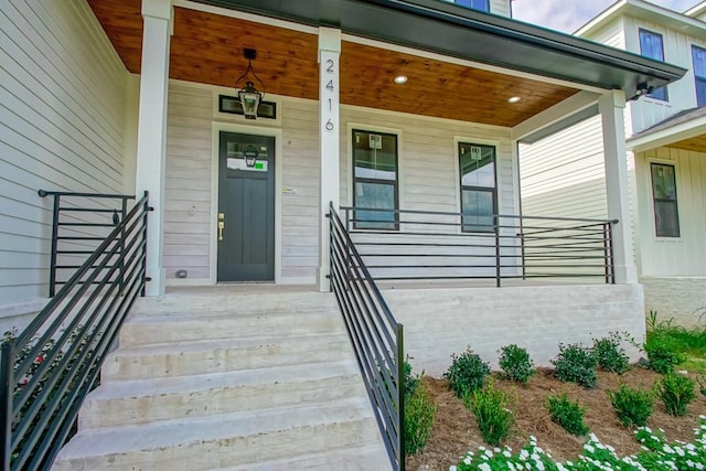 doorway to property with covered porch