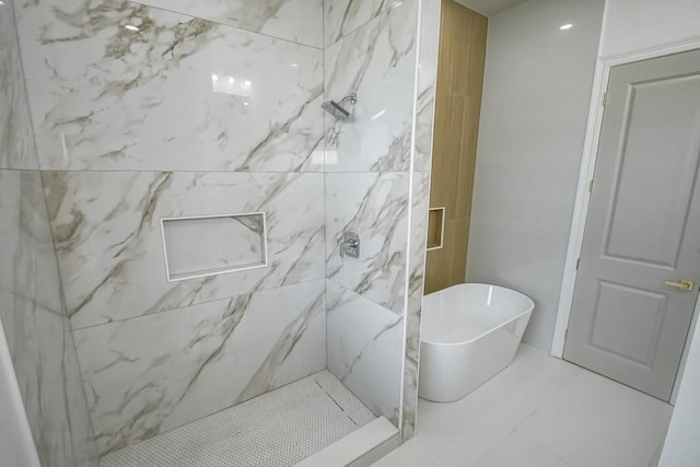 bathroom featuring separate shower and tub