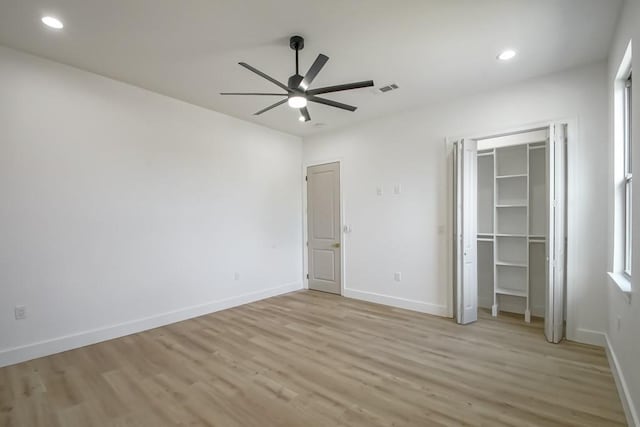 unfurnished bedroom featuring ceiling fan and light hardwood / wood-style flooring