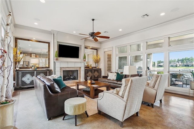 living room featuring ceiling fan and crown molding