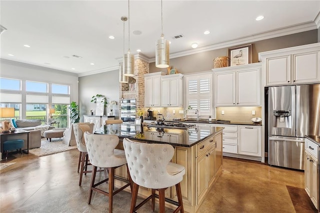 kitchen with pendant lighting, a center island, tasteful backsplash, appliances with stainless steel finishes, and crown molding