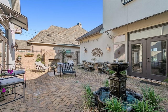 view of patio featuring french doors