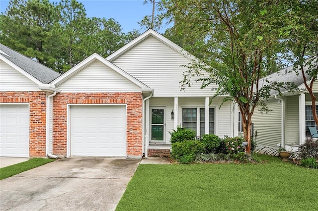 view of front of home featuring a front yard and a garage