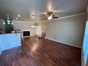 unfurnished living room with dark hardwood / wood-style floors, crown molding, and ceiling fan