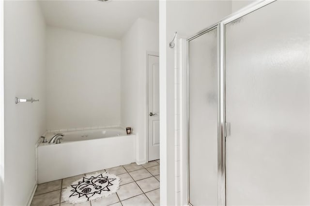 bathroom featuring shower with separate bathtub and tile patterned floors