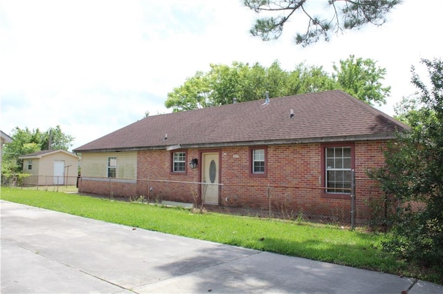 view of side of property with a garage and a yard