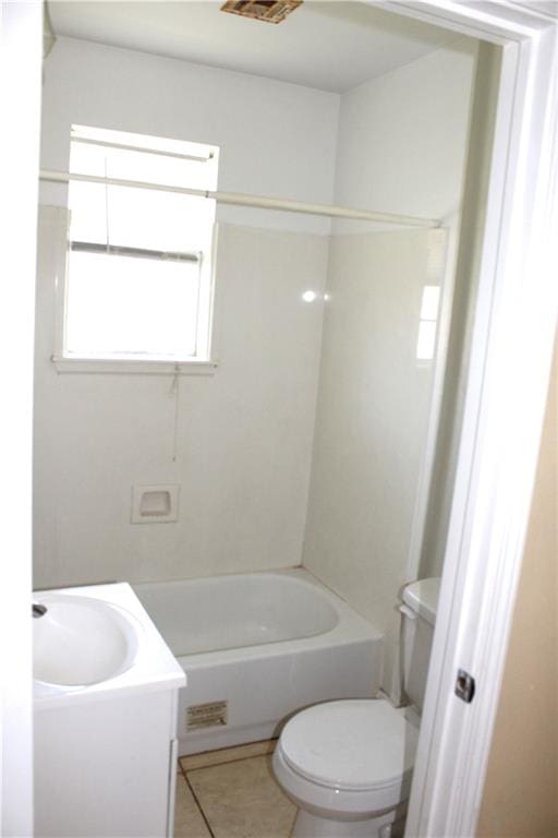 full bathroom featuring bathing tub / shower combination, tile patterned flooring, vanity, and toilet