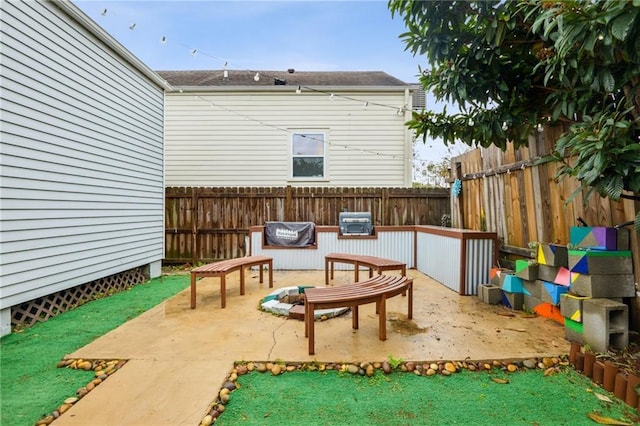 view of patio / terrace featuring fence