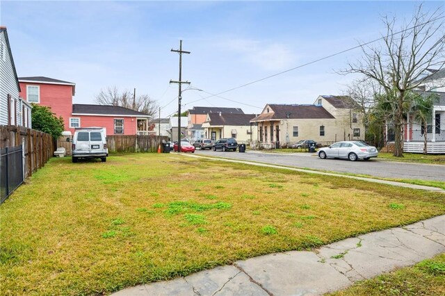 view of yard with fence and a residential view