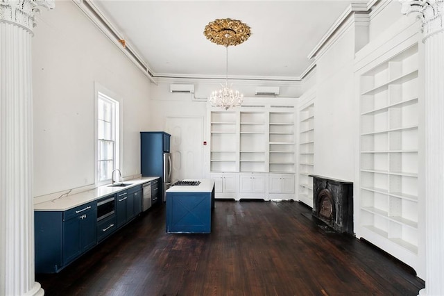 interior space featuring crown molding, a chandelier, sink, and dark hardwood / wood-style flooring