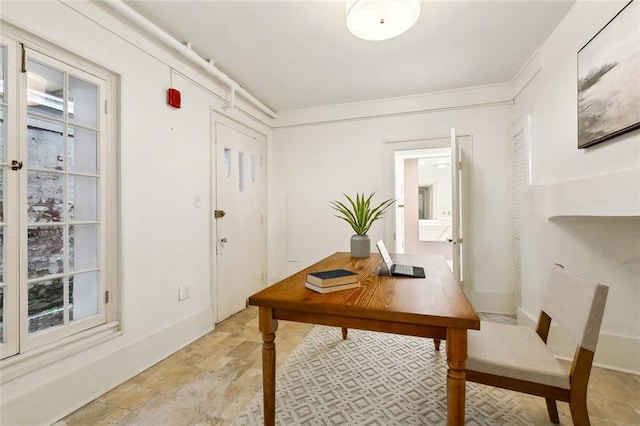 600 Esplanade Ave Unit 1, New Orleans, LA 70116 - office with baseboards and stone finish floor