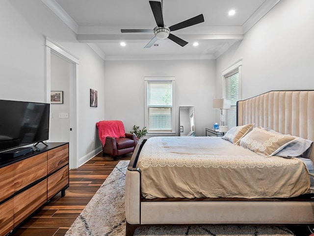 bedroom with ornamental molding, dark hardwood / wood-style floors, and ceiling fan