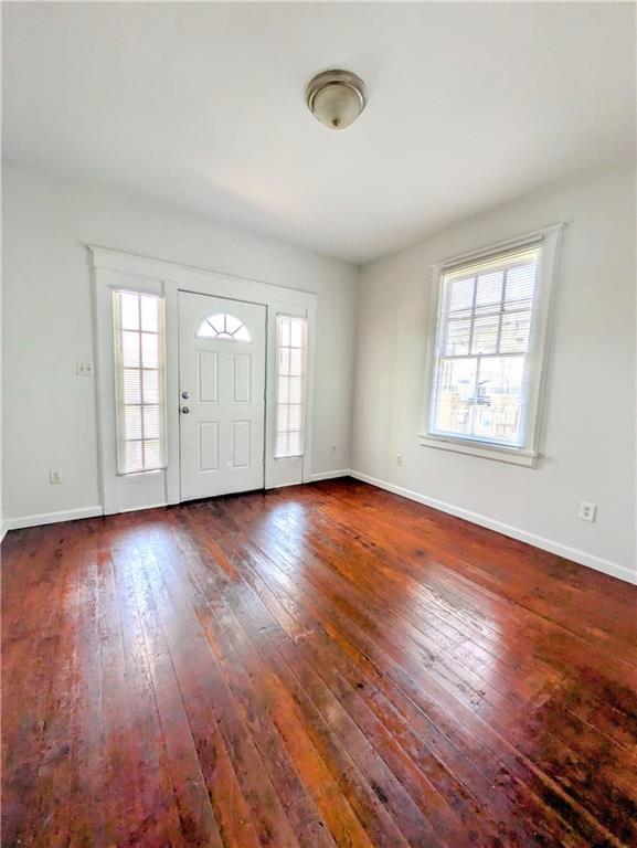 hallway featuring dark hardwood / wood-style flooring