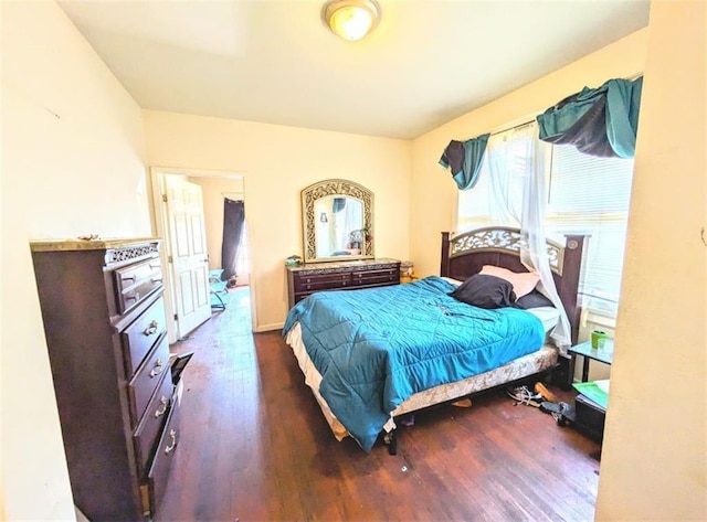 bedroom featuring dark hardwood / wood-style flooring