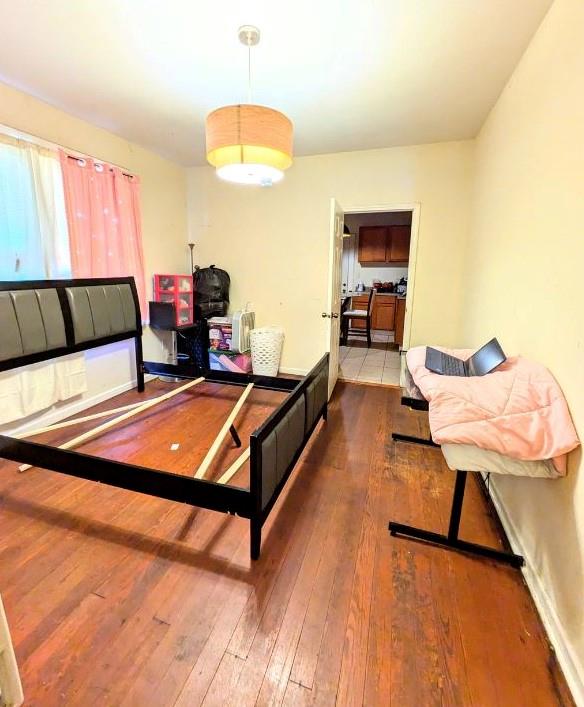 bedroom featuring wood-type flooring